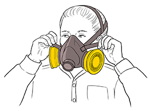 Woman tightening straps on half-mask respirator.